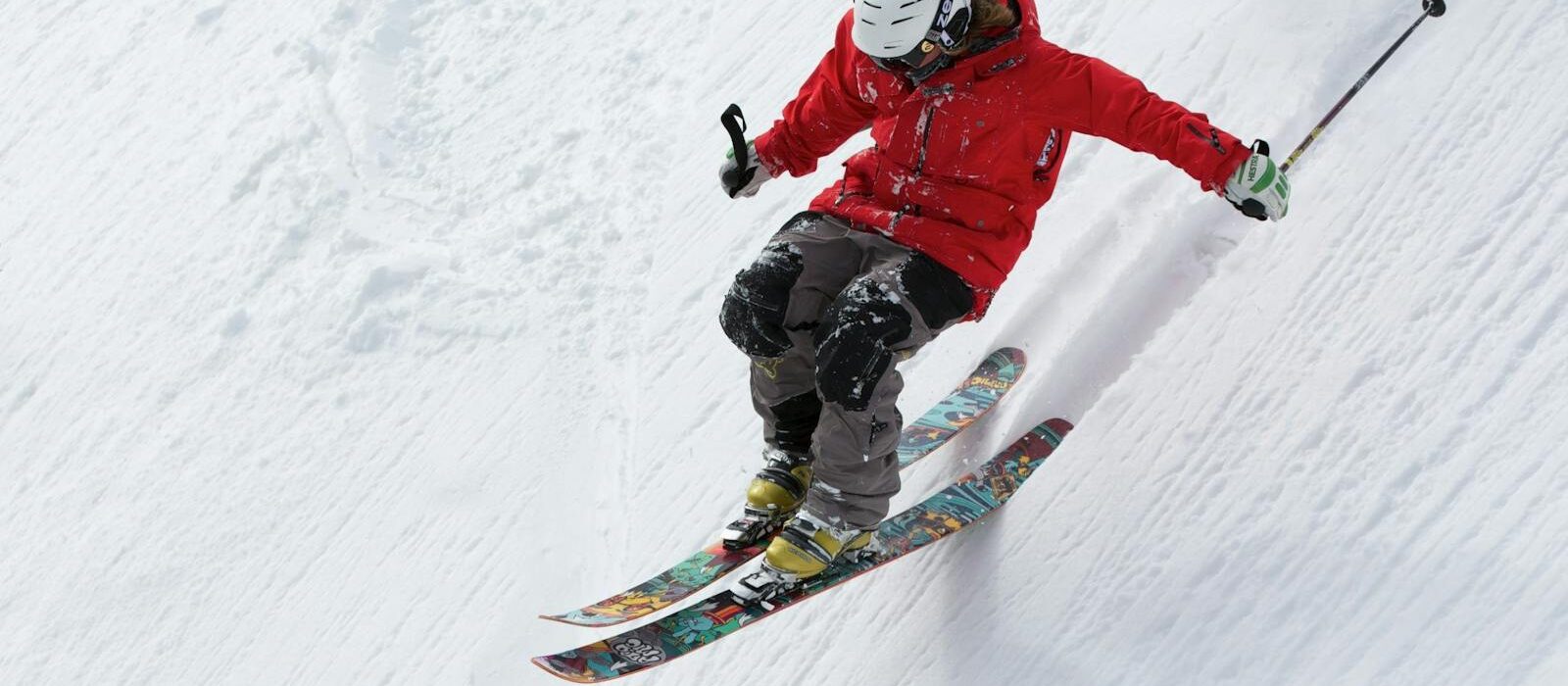 Man in Red Jacket Playing Ice Skates during Day Time